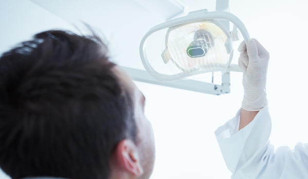 a man in a dentist chair before check-up