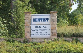 Office outdoor information board that reads Dentist. Dental Care Acworth 678.888.1554 DentistinAcworth.com