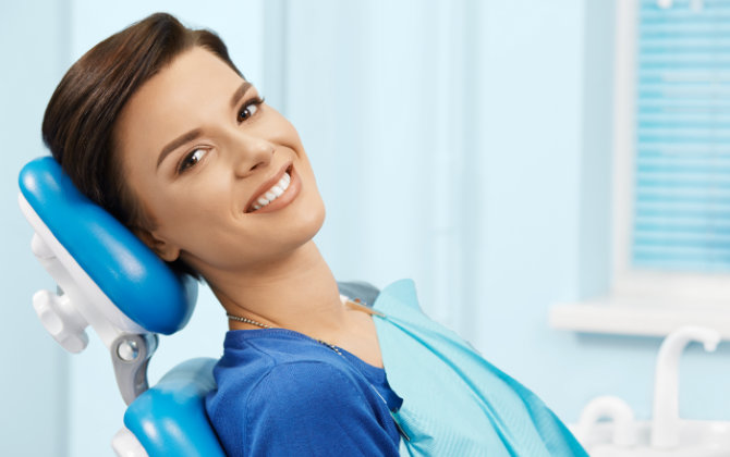 smiling woman in a dental chair