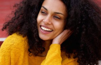 laughing african american woman with beautiful smile