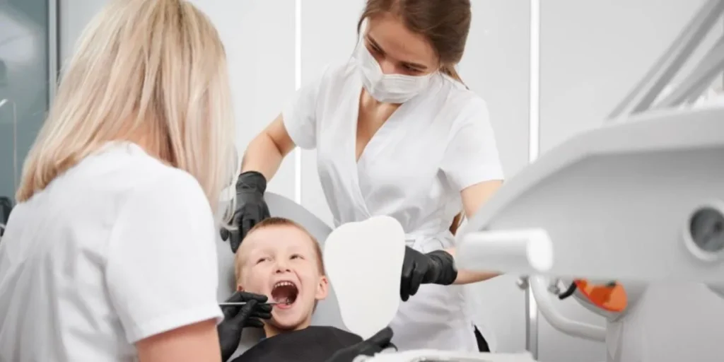 Child receiving preventive care at family dental clinic